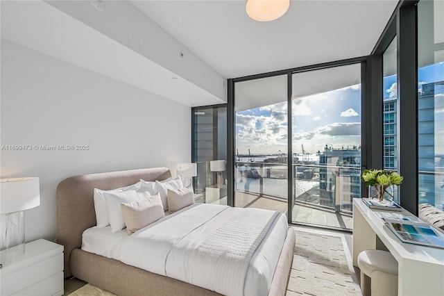 500 Alton Unit 2405/06, Miami Beach, FL 33139 - bedroom with access to outside and a wall of windows