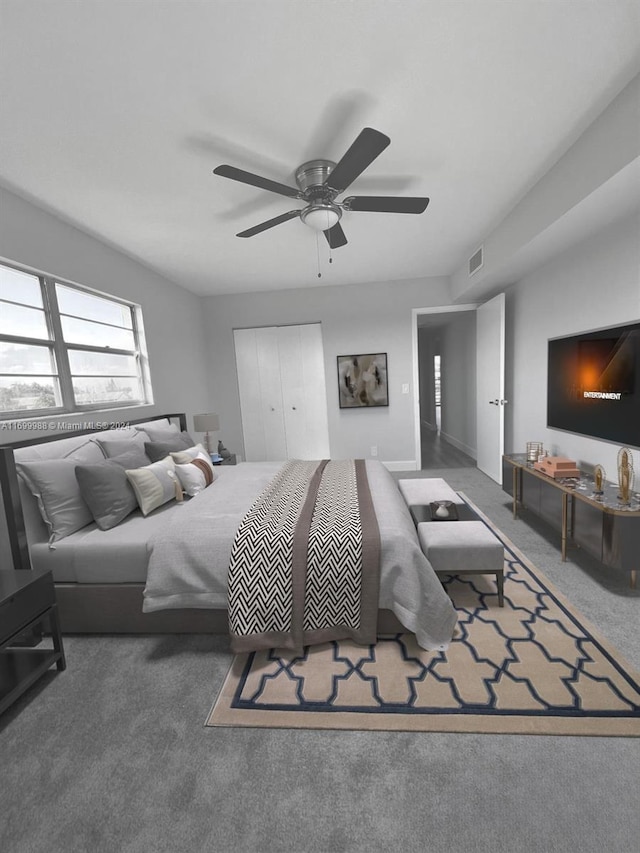 bedroom featuring carpet, ceiling fan, and a closet