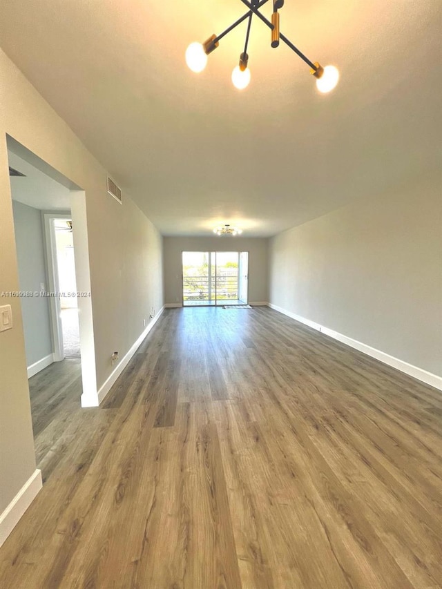 empty room with hardwood / wood-style floors