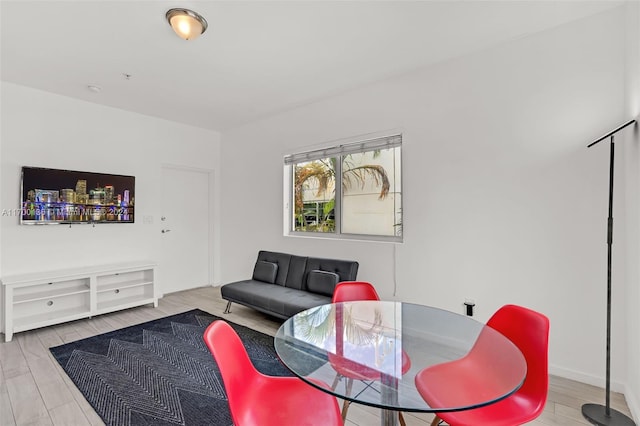 living room with light hardwood / wood-style flooring