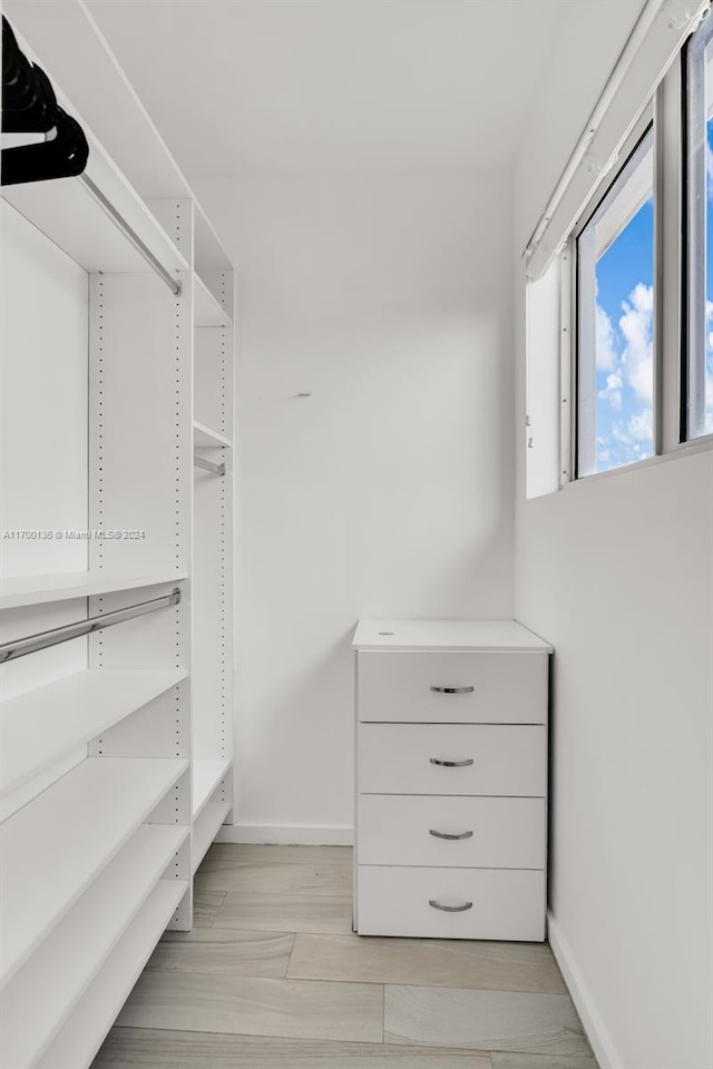 walk in closet featuring light wood-type flooring