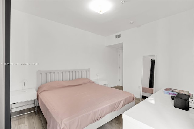 bedroom featuring wood-type flooring and billiards