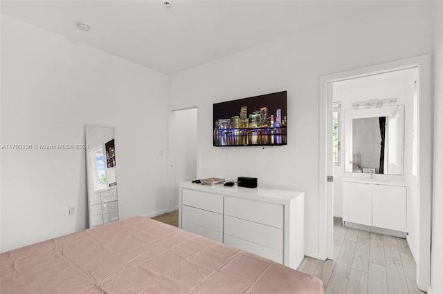 bedroom with light hardwood / wood-style floors