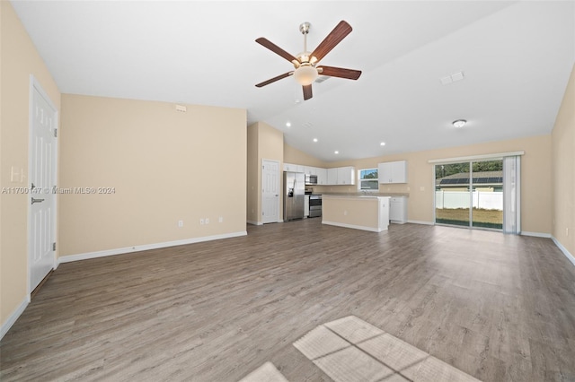 unfurnished living room with ceiling fan, light wood-type flooring, and lofted ceiling