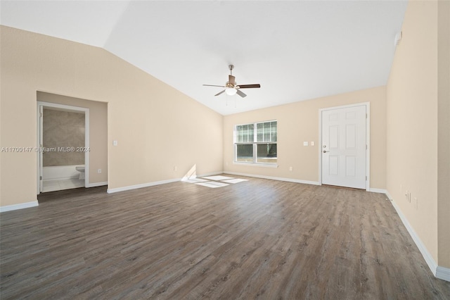 unfurnished living room featuring ceiling fan, dark hardwood / wood-style flooring, and vaulted ceiling