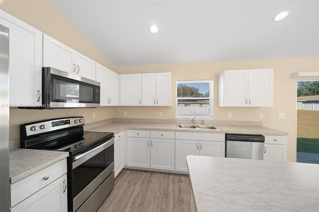 kitchen featuring white cabinetry, sink, stainless steel appliances, and plenty of natural light