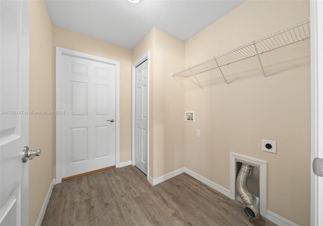 laundry area featuring hookup for a washing machine, hardwood / wood-style flooring, and electric dryer hookup