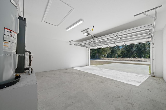 garage featuring electric water heater and a garage door opener