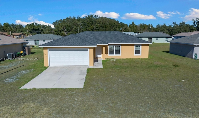 single story home featuring a front yard and a garage