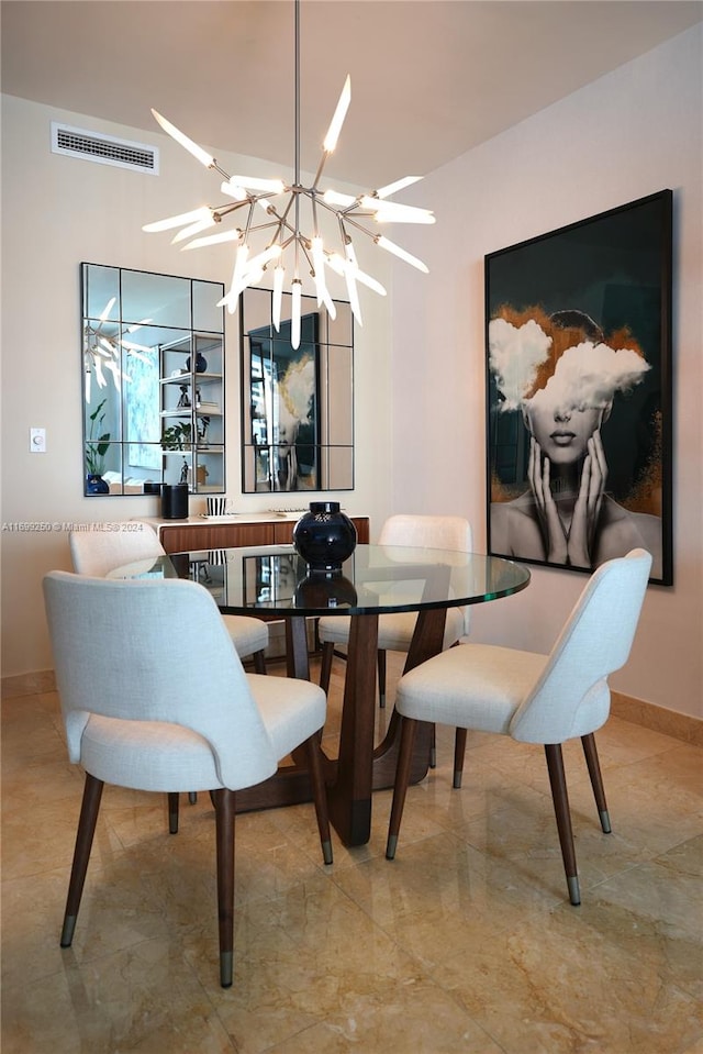 dining space featuring a chandelier