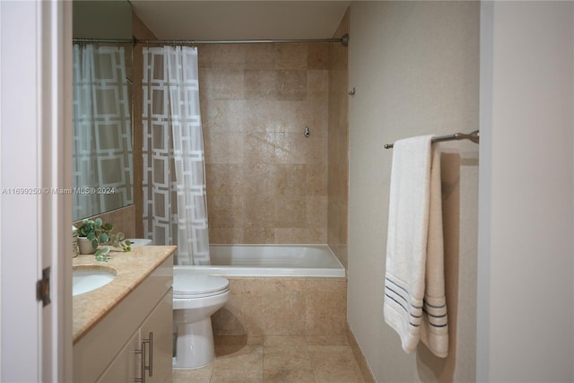 full bathroom featuring toilet, vanity, tile patterned floors, and shower / bathtub combination with curtain