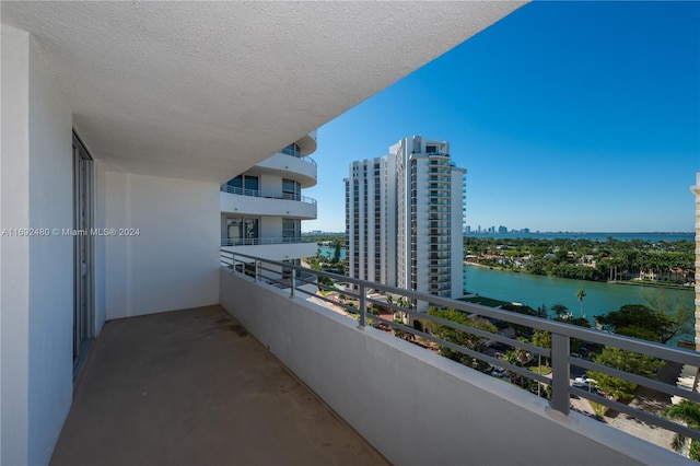 balcony featuring a water view