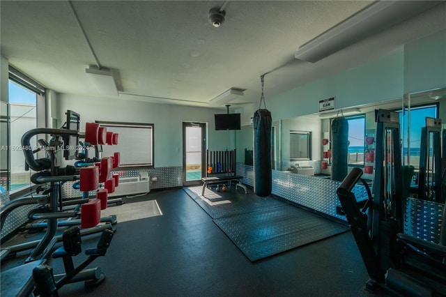 gym featuring a textured ceiling