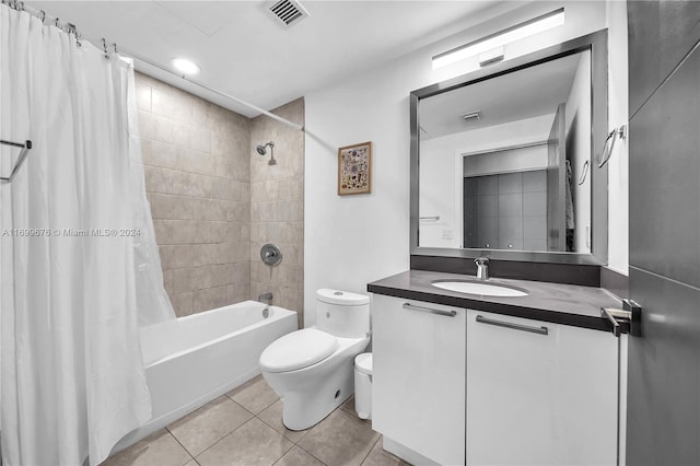 full bathroom featuring toilet, shower / bath combo, vanity, and tile patterned floors