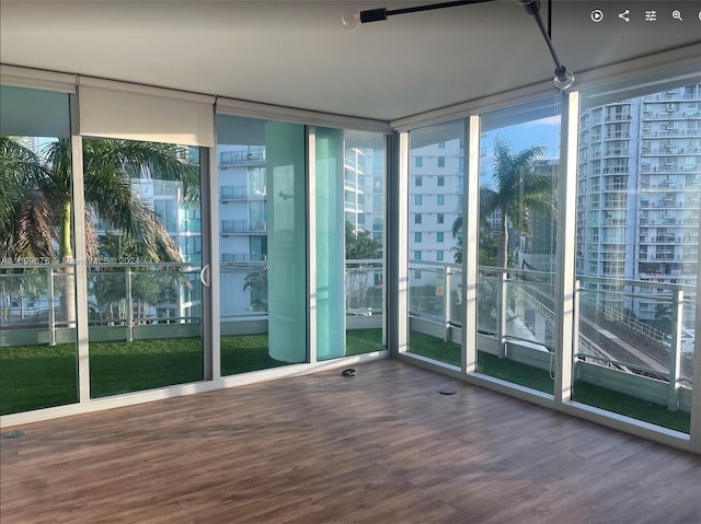 unfurnished sunroom with a wealth of natural light