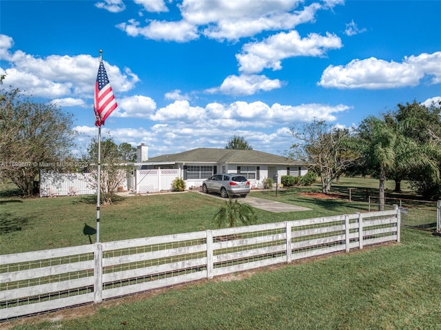 ranch-style house with a front yard and a fenced front yard