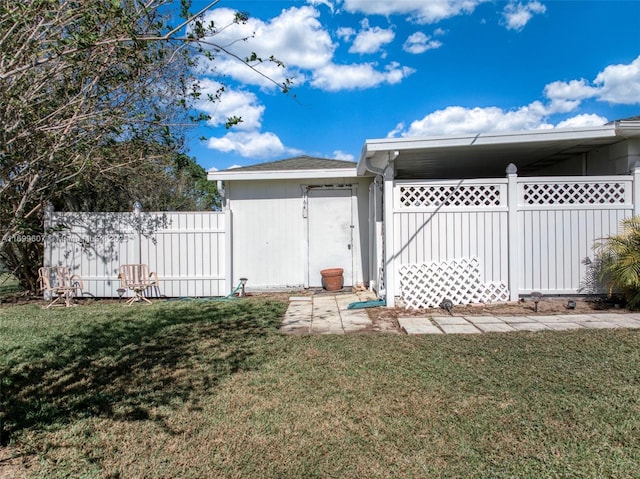 exterior space with a yard and fence