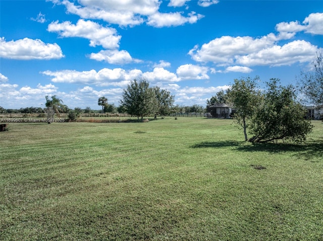 view of yard with a rural view