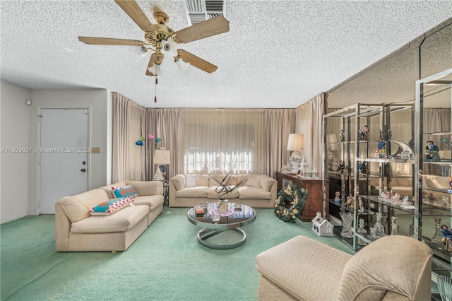 carpeted living room with visible vents, a textured ceiling, and ceiling fan