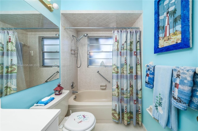 bathroom featuring a wealth of natural light, toilet, shower / bath combo with shower curtain, and vanity