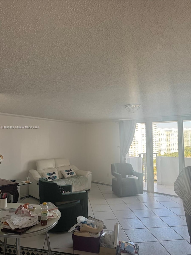 2750 NE 183rd St Unit 1210, Aventura, FL 33160 - living room featuring a textured ceiling and light tile patterned floors