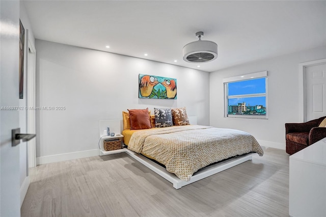 bedroom with light hardwood / wood-style flooring