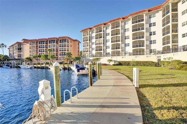 dock area featuring a yard and a water view