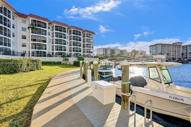 dock area featuring a yard and a water view