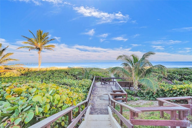 exterior space featuring a view of the beach and a water view