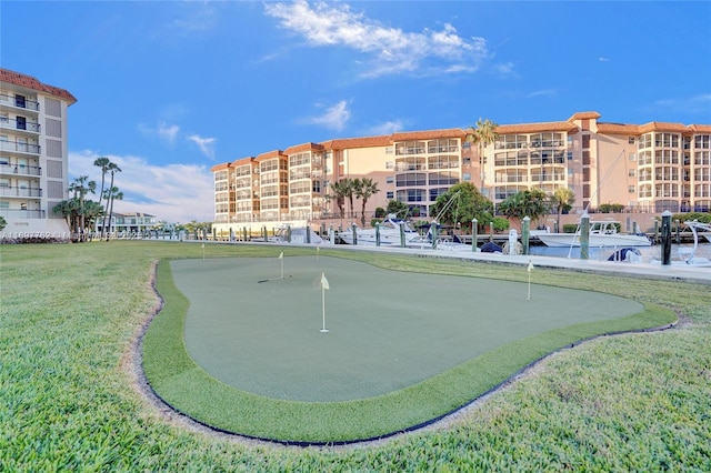 view of home's community featuring a lawn