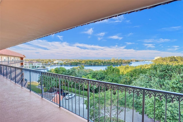 balcony featuring a water view