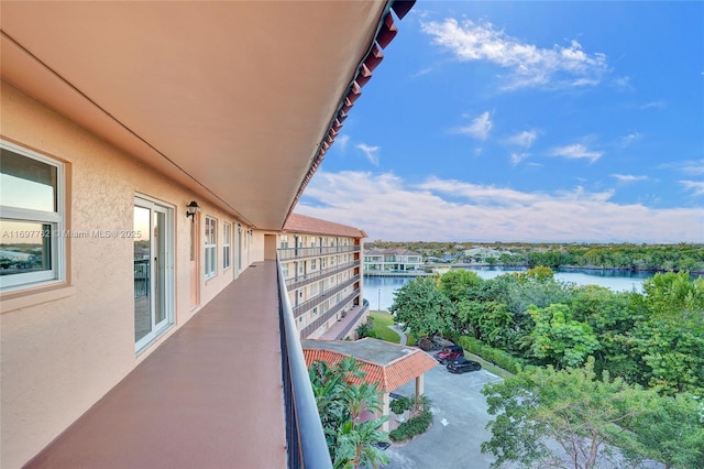 balcony featuring a water view