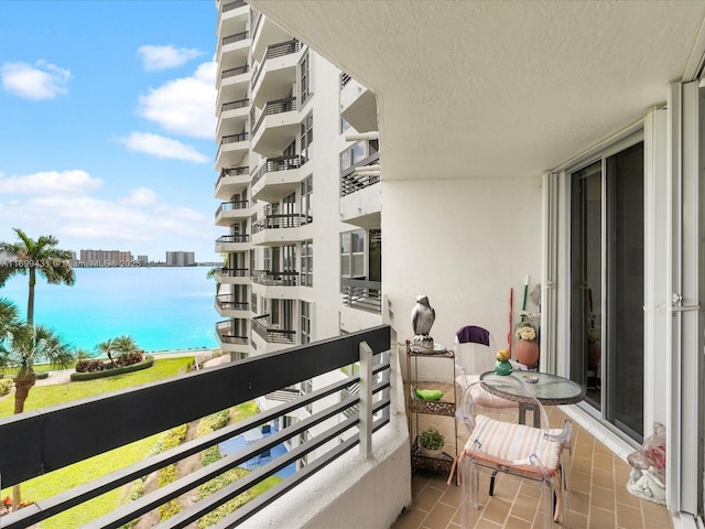 balcony featuring a water view