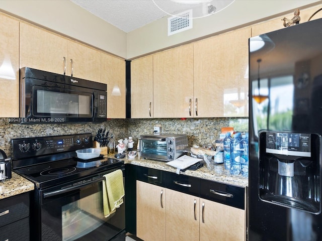 kitchen with decorative backsplash, light brown cabinetry, light stone countertops, a textured ceiling, and black appliances