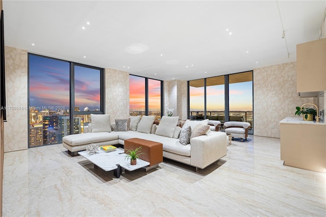 living room featuring expansive windows and marble finish floor