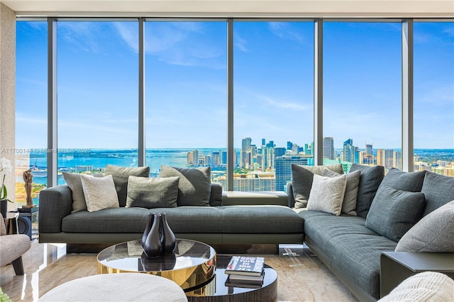 living room with a water view and expansive windows