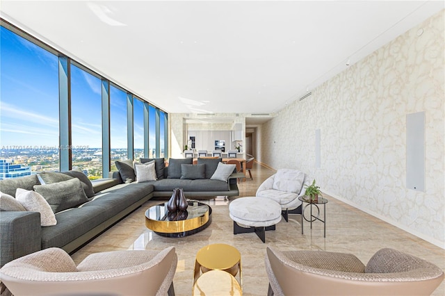 living room featuring a wall of windows