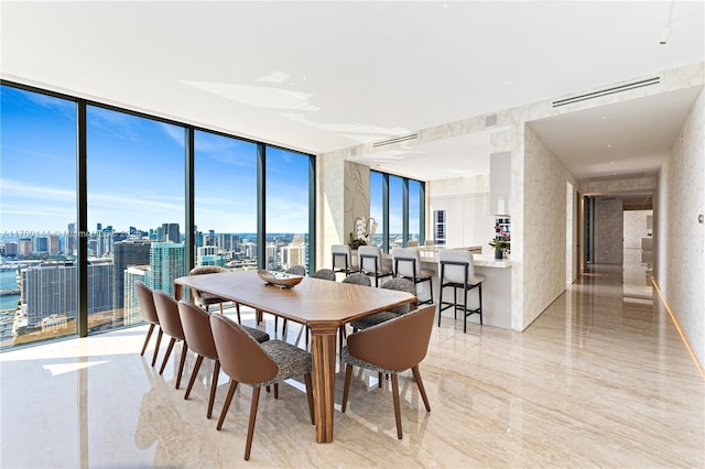 dining area featuring floor to ceiling windows