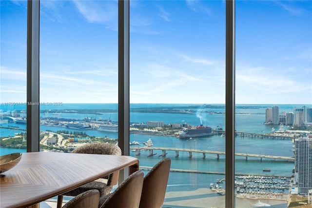 balcony with a water view and a city view