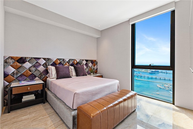 bedroom featuring floor to ceiling windows