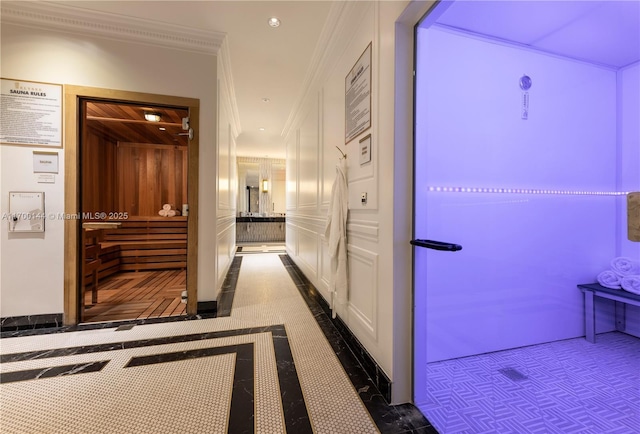 hallway featuring ornamental molding