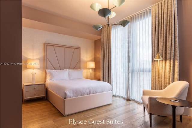 bedroom featuring light wood-style flooring