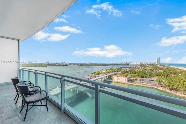 balcony featuring a water view