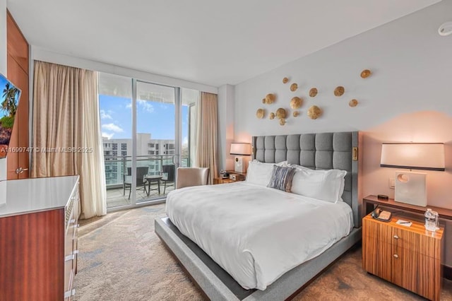 bedroom with carpet flooring, a wall of windows, and access to outside