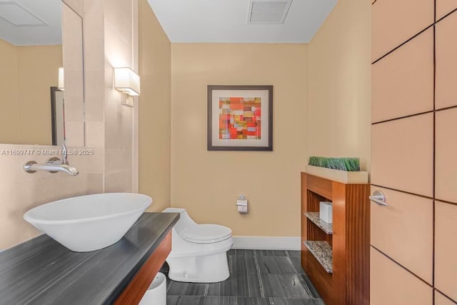 bathroom with vanity and toilet