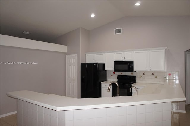 kitchen featuring black appliances, white cabinets, kitchen peninsula, and tasteful backsplash