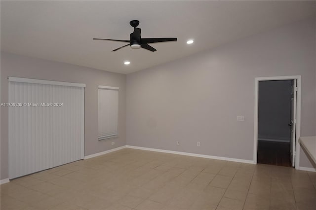 unfurnished bedroom with ceiling fan and light tile patterned flooring