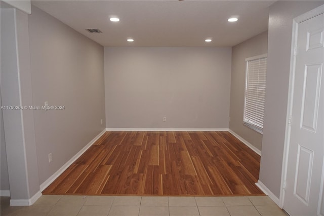 unfurnished room featuring hardwood / wood-style flooring