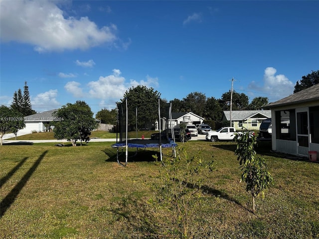 view of yard with a trampoline