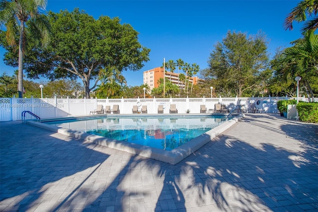 view of swimming pool with a patio area